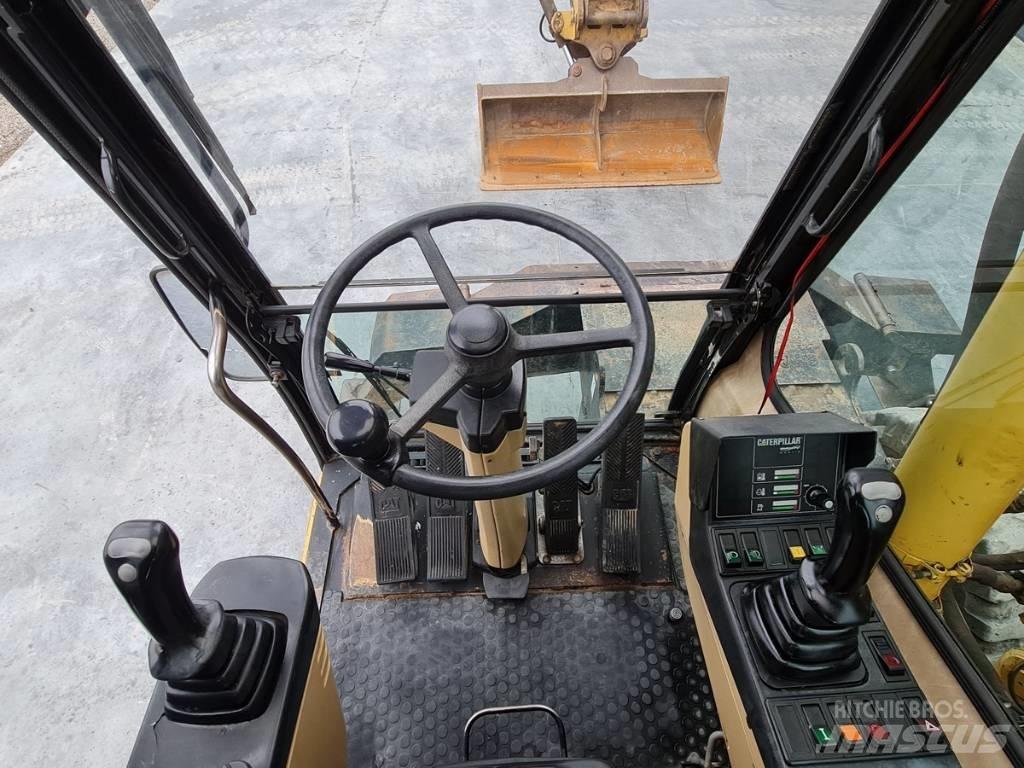 CAT M 312 Колісні екскаватори