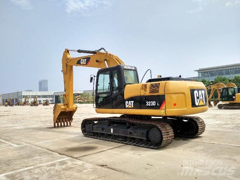 CAT 323 Гусеничні екскаватори
