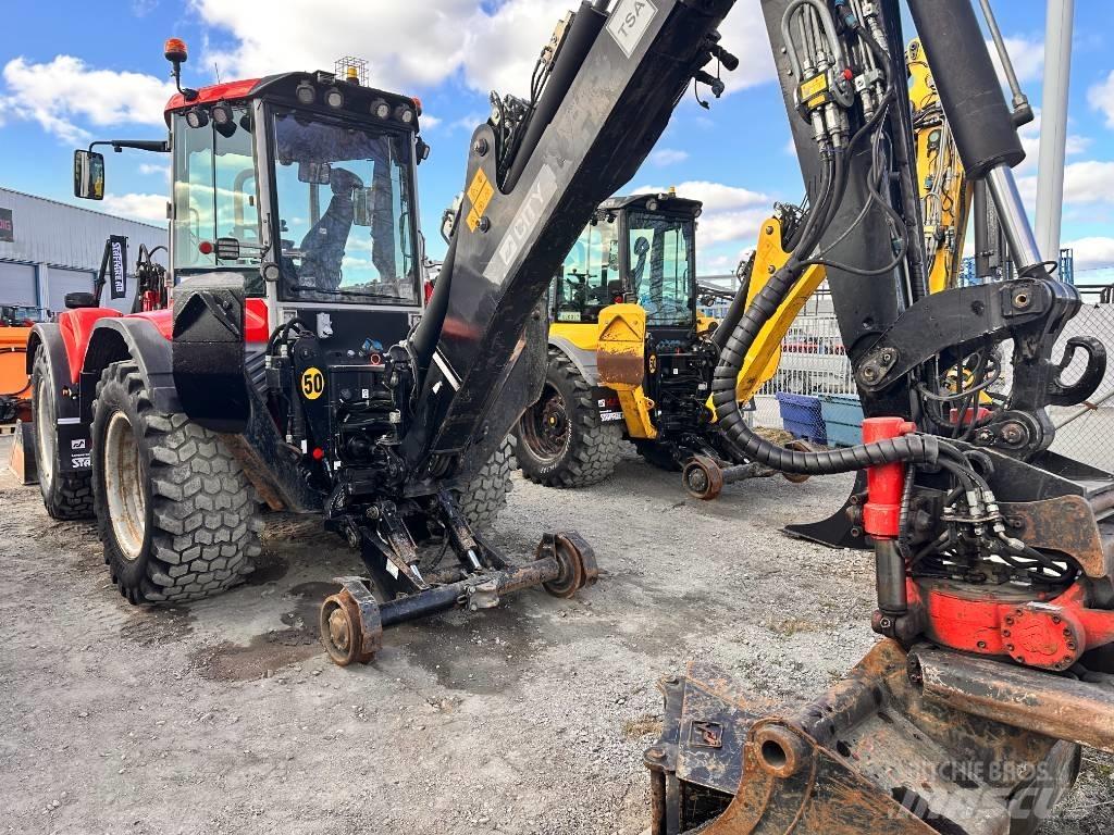 Huddig 1260 C Екскаватори-навантажувачі