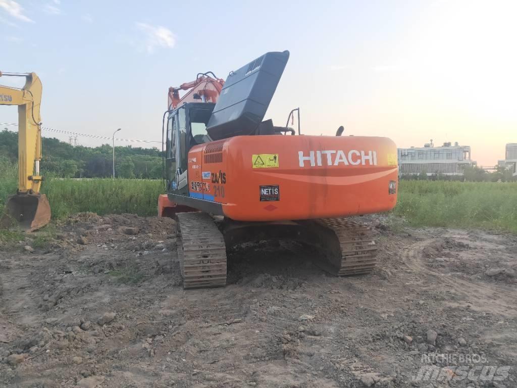 Hitachi ZX 210 Гусеничні екскаватори