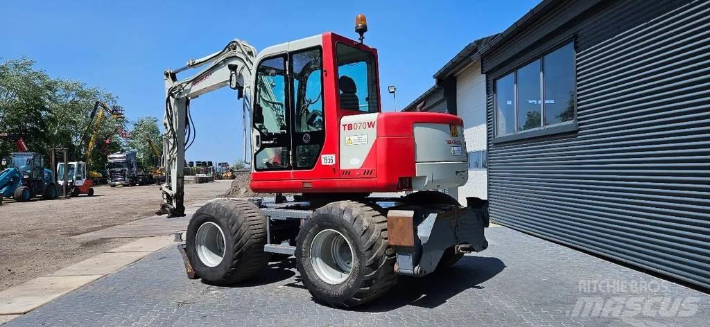Takeuchi TB070 W Середні екскаватори 7т. - 12т.