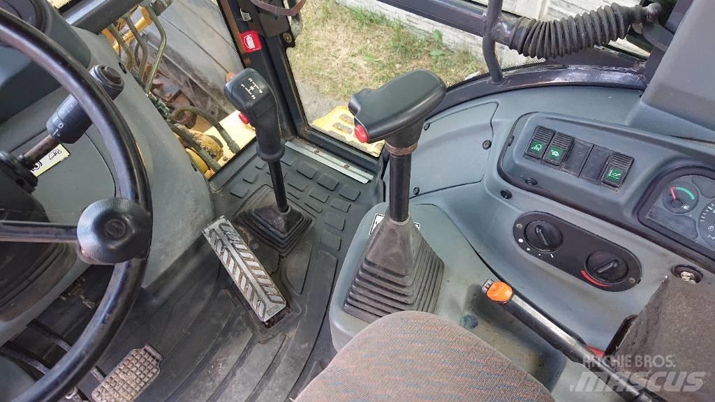 New Holland LB 110 Екскаватори-навантажувачі