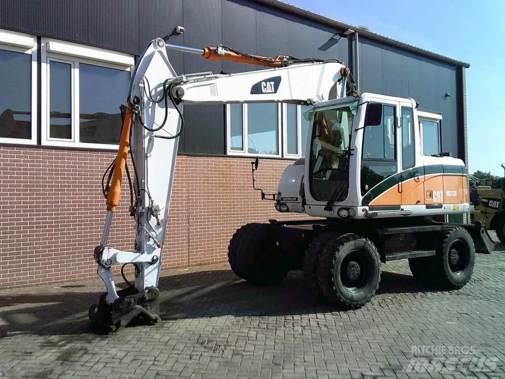 CAT M313D Колісні екскаватори
