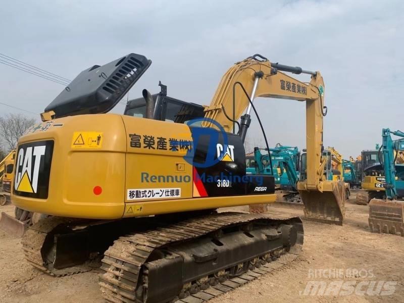 CAT 318DL Гусеничні екскаватори