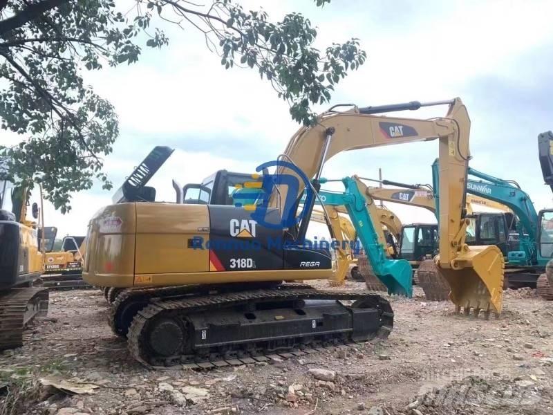 CAT 318DL Гусеничні екскаватори