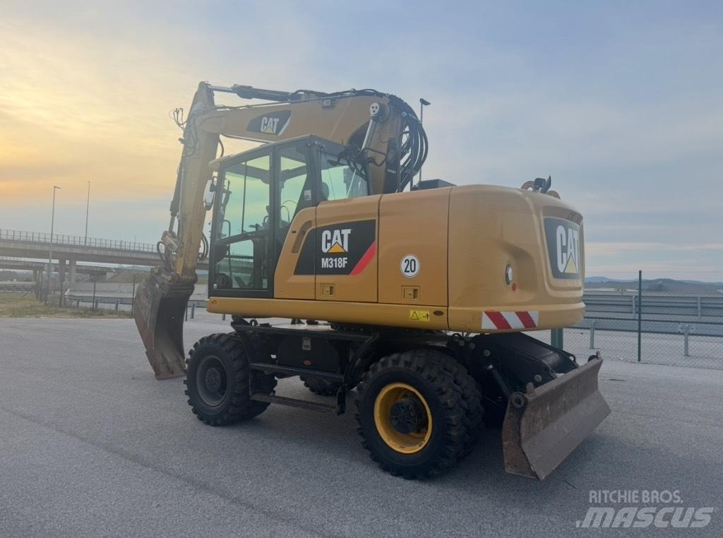 CAT M 318 F Колісні екскаватори