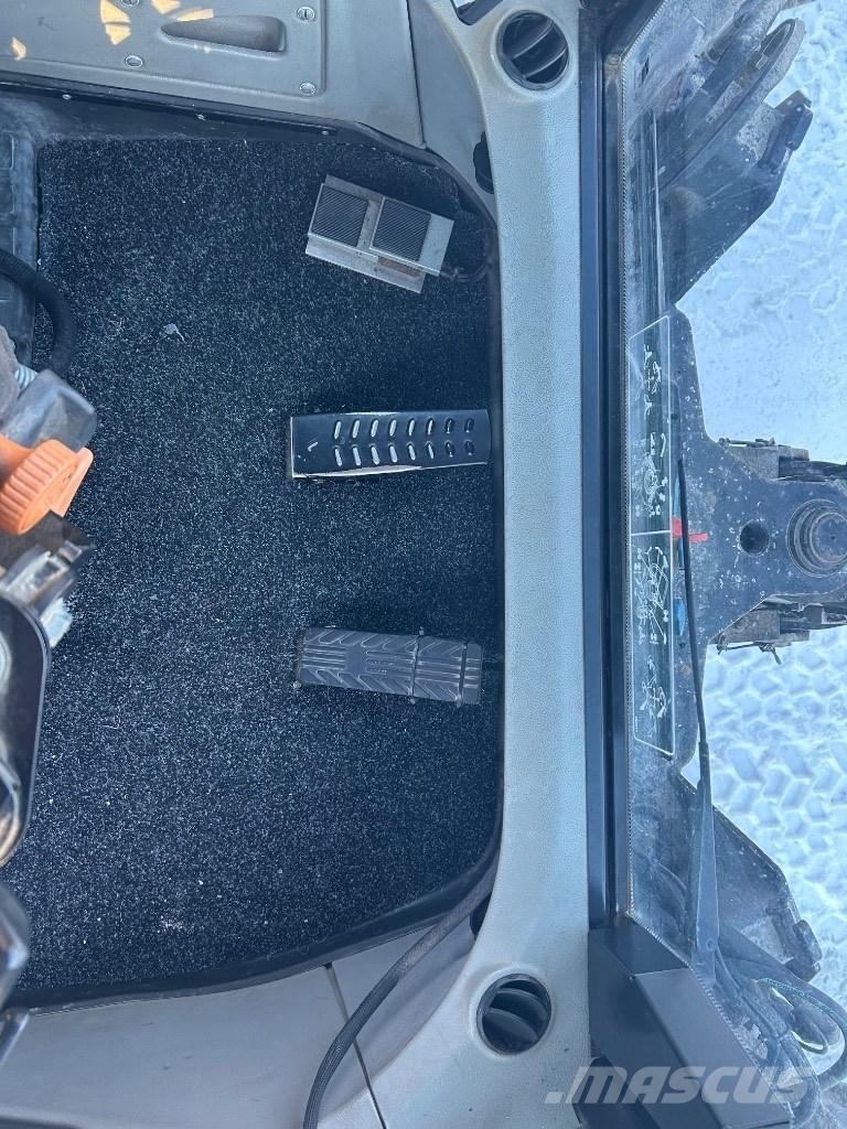 Huddig 1260 C Екскаватори-навантажувачі