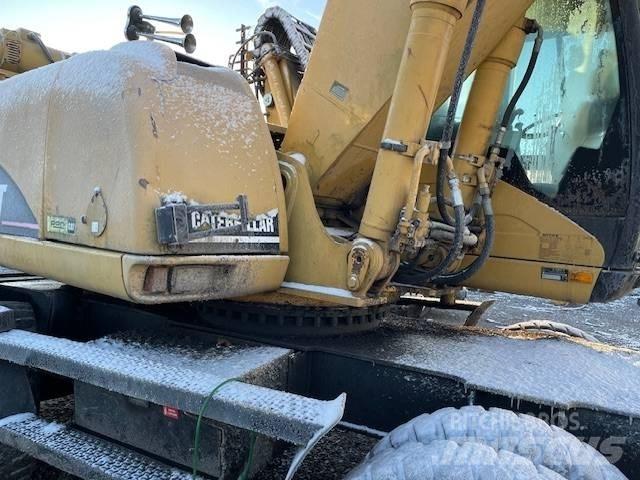 CAT M 322 C MH Колісні екскаватори