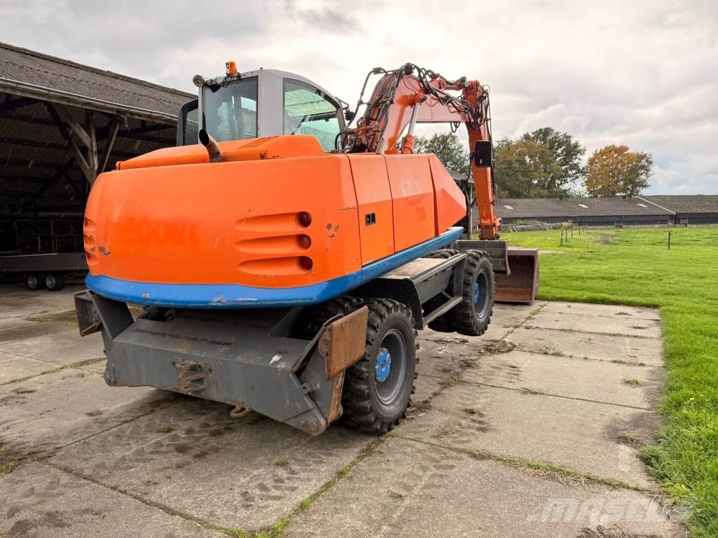 Atlas terex Екскаватори