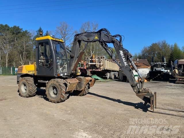 Mecalac 12 M TX Колісні екскаватори