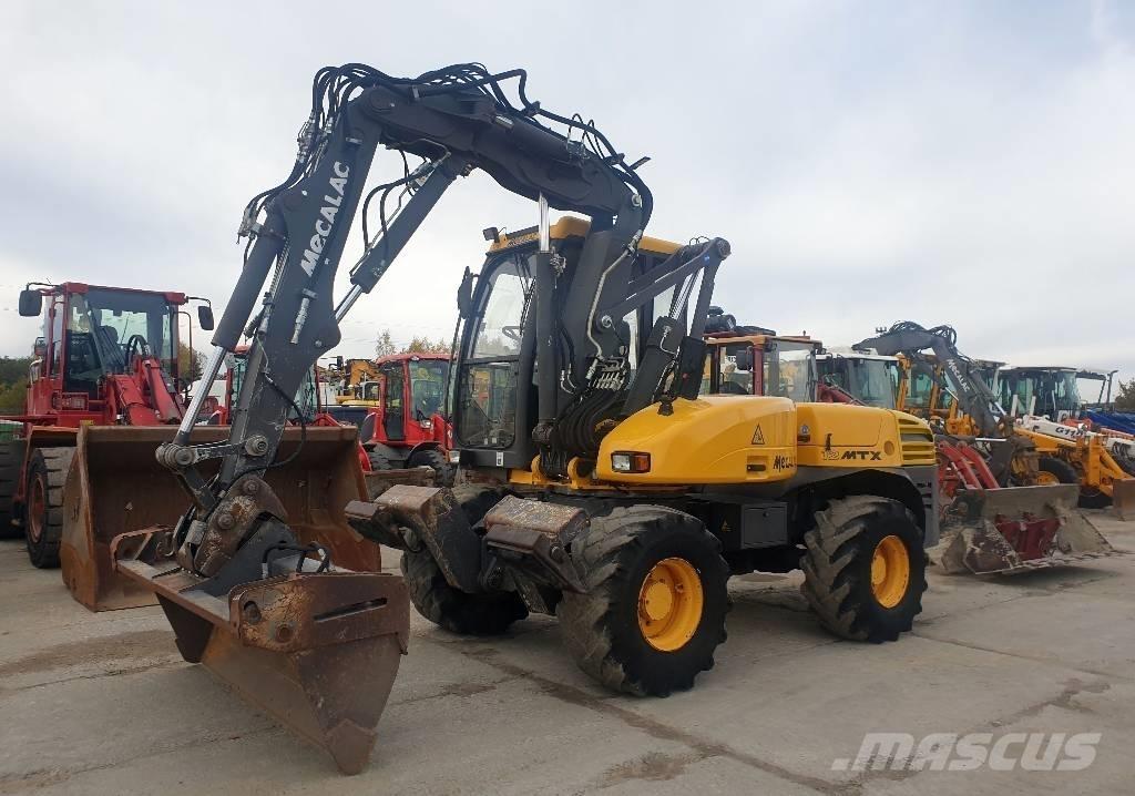 Mecalac 12 M TX Колісні екскаватори