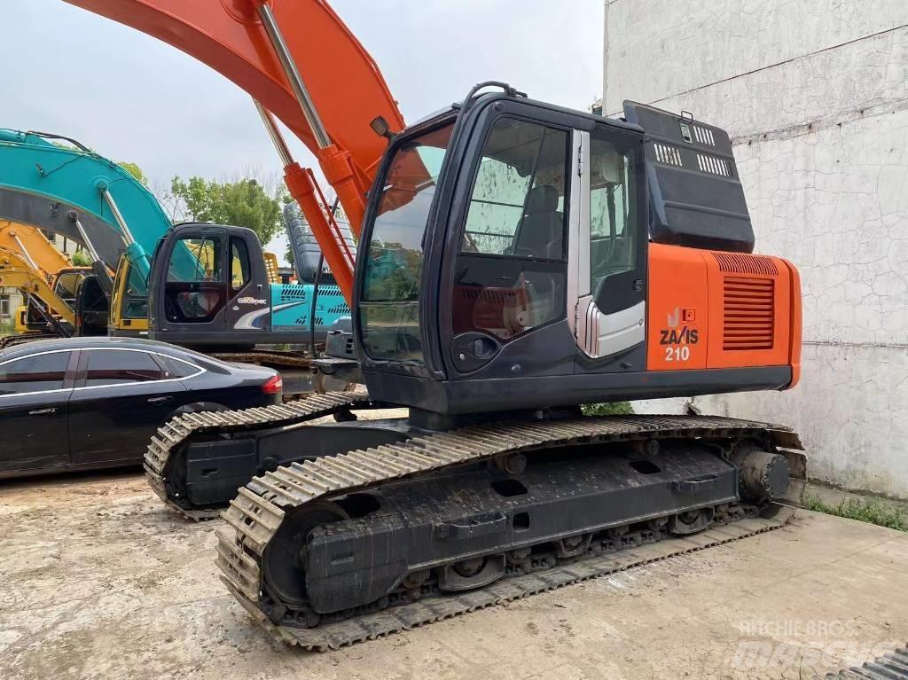 Hitachi ZX 210 Гусеничні екскаватори