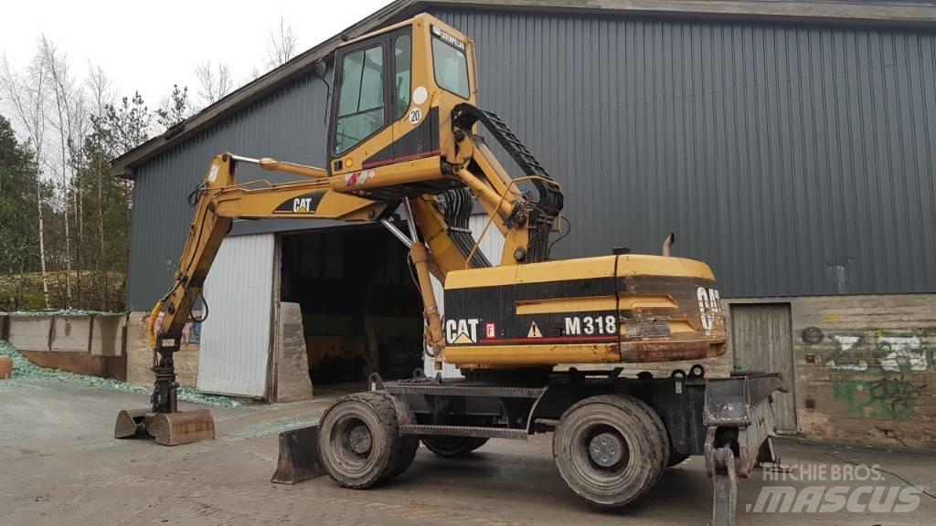 CAT M 318 Перевантажувачі металобрухту/промислові навантажувачі