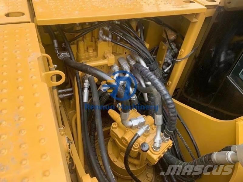 CAT 318DL Гусеничні екскаватори
