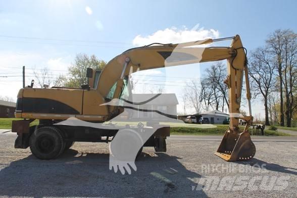 CAT M318C Колісні екскаватори