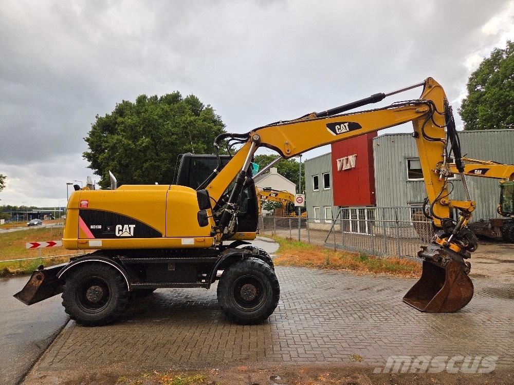 CAT M313D Колісні екскаватори
