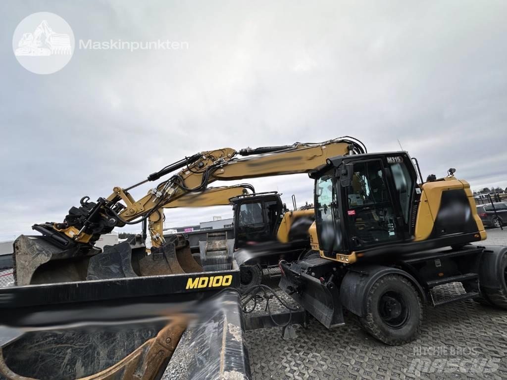 CAT M 315 Колісні екскаватори