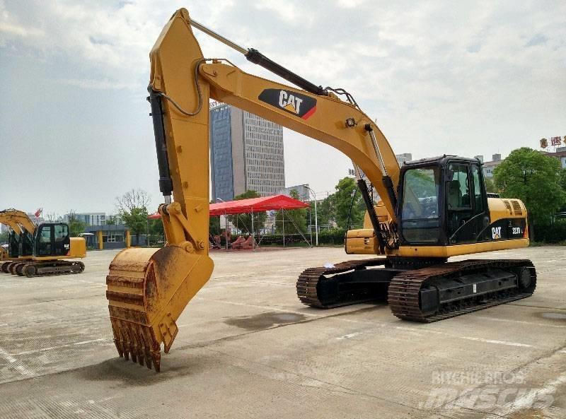 CAT 323 Гусеничні екскаватори