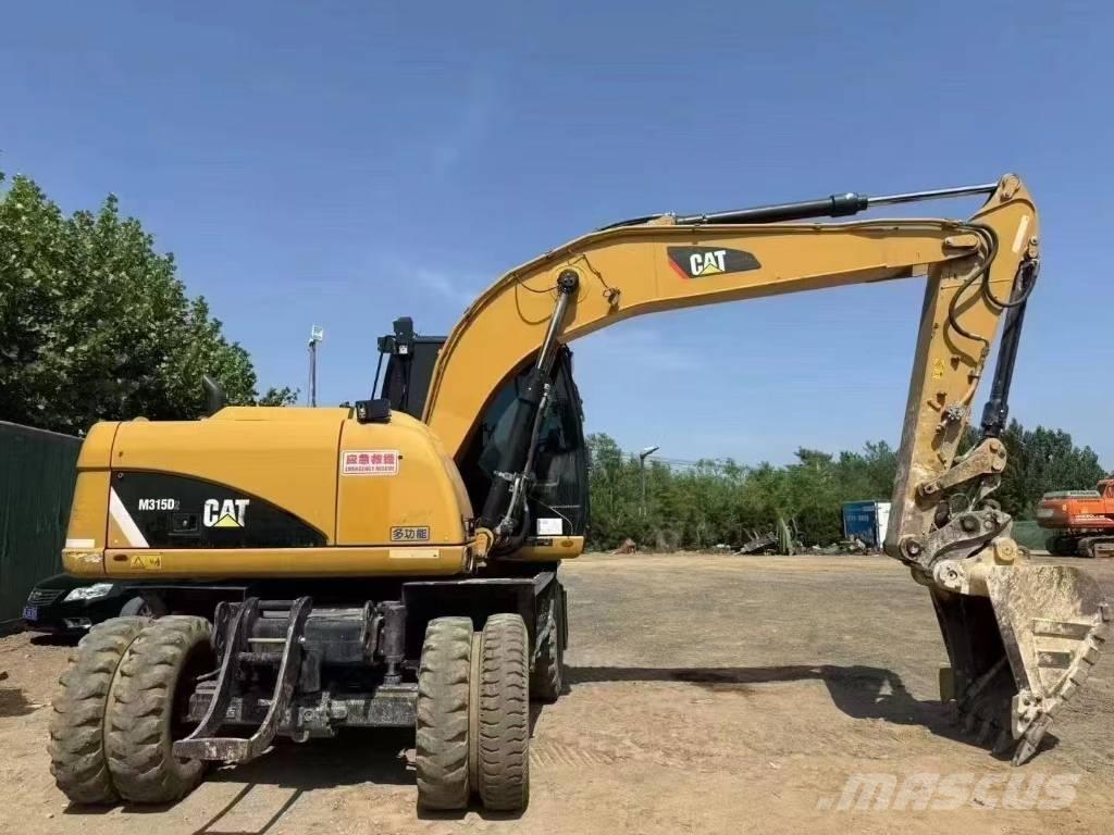 CAT M 315 D Колісні екскаватори
