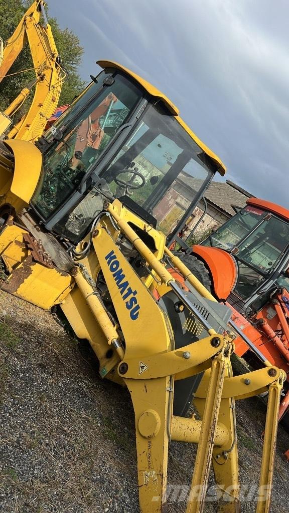 Komatsu WB 93 R Гусениці