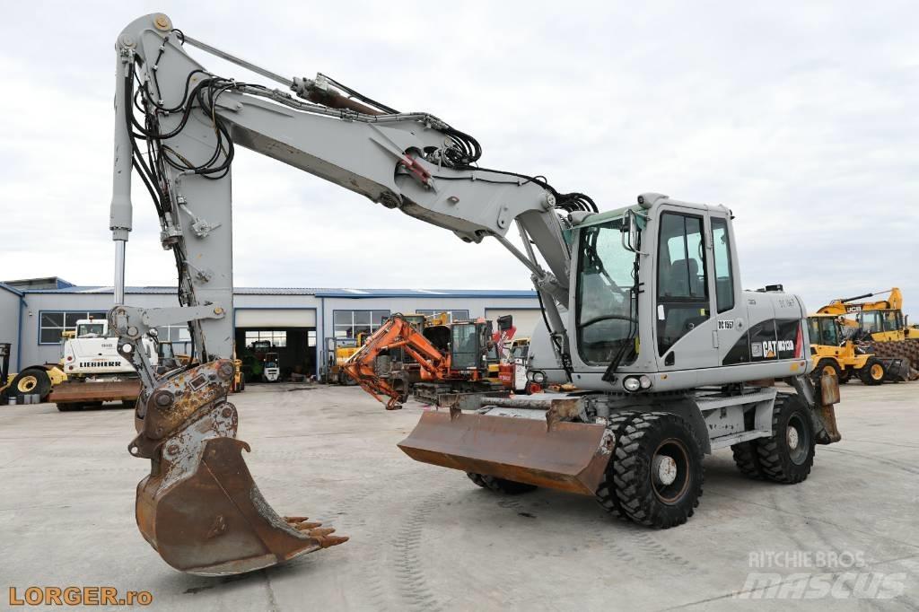 CAT M 313 D Колісні екскаватори