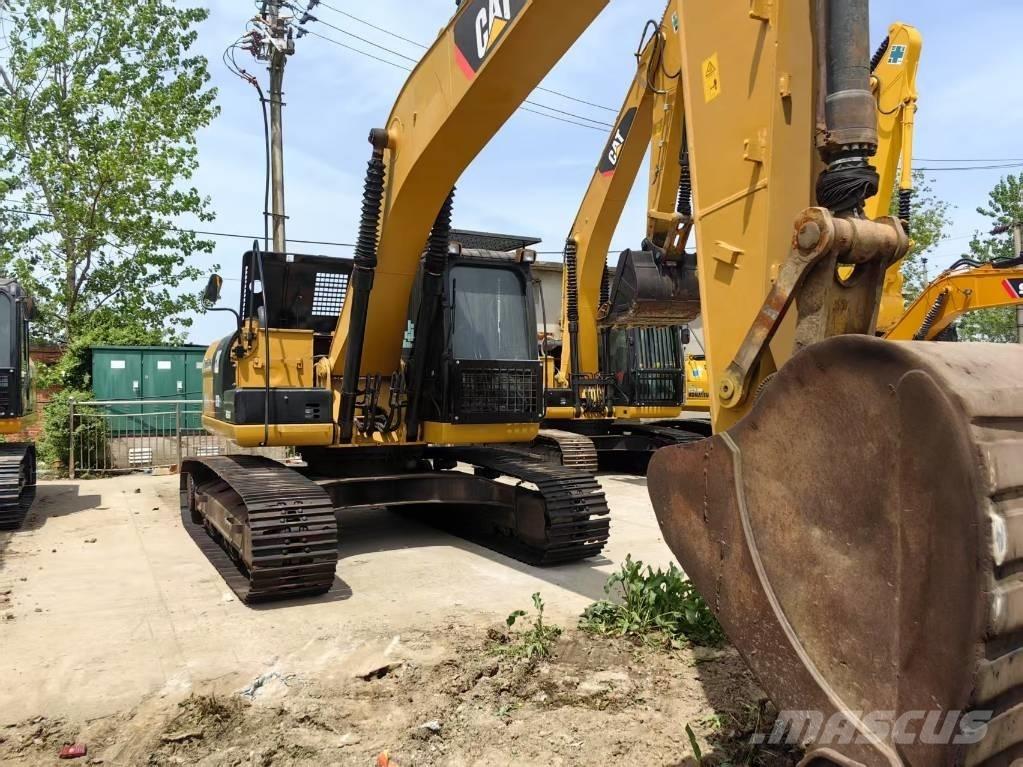 CAT 323 D Гусеничні екскаватори