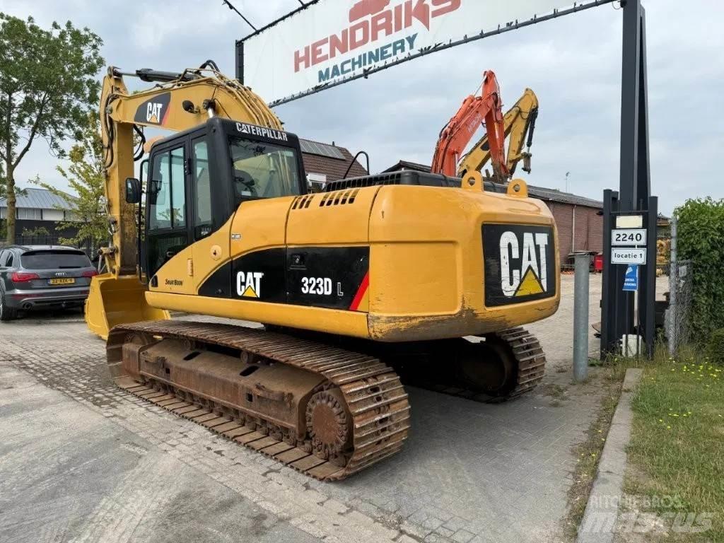 CAT 323DL (320DL) Гусеничні екскаватори