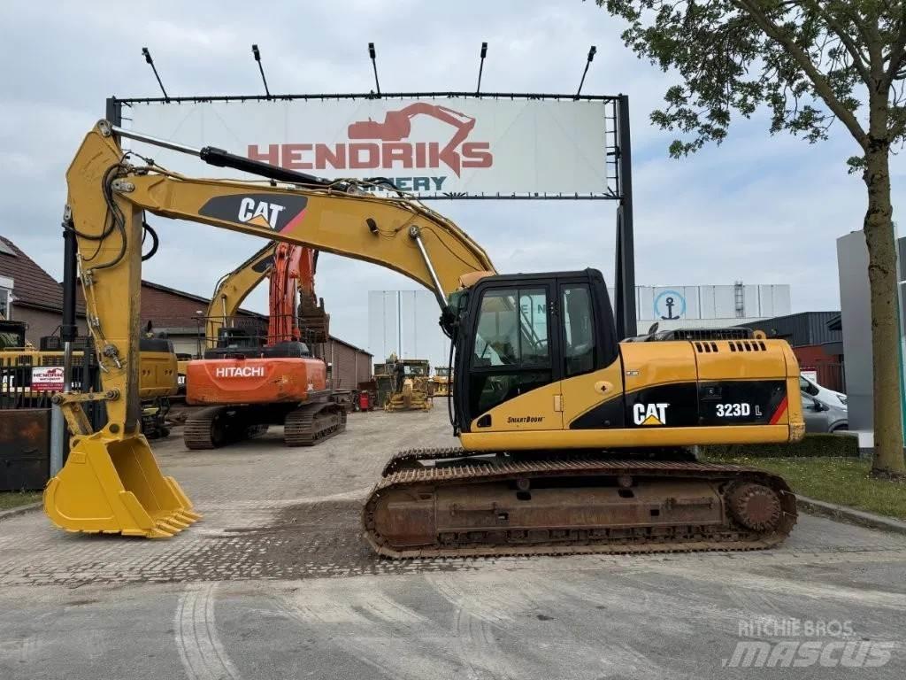 CAT 323DL (320DL) Гусеничні екскаватори
