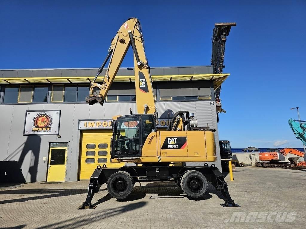 CAT MH 3022 Колісні екскаватори