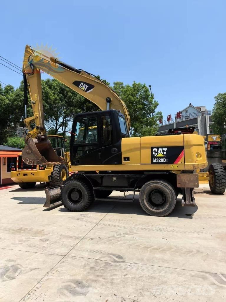 CAT M 320D2 Колісні екскаватори