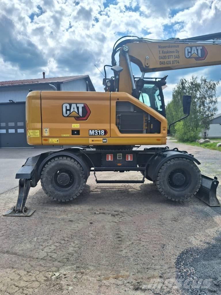 CAT M 318 Колісні екскаватори