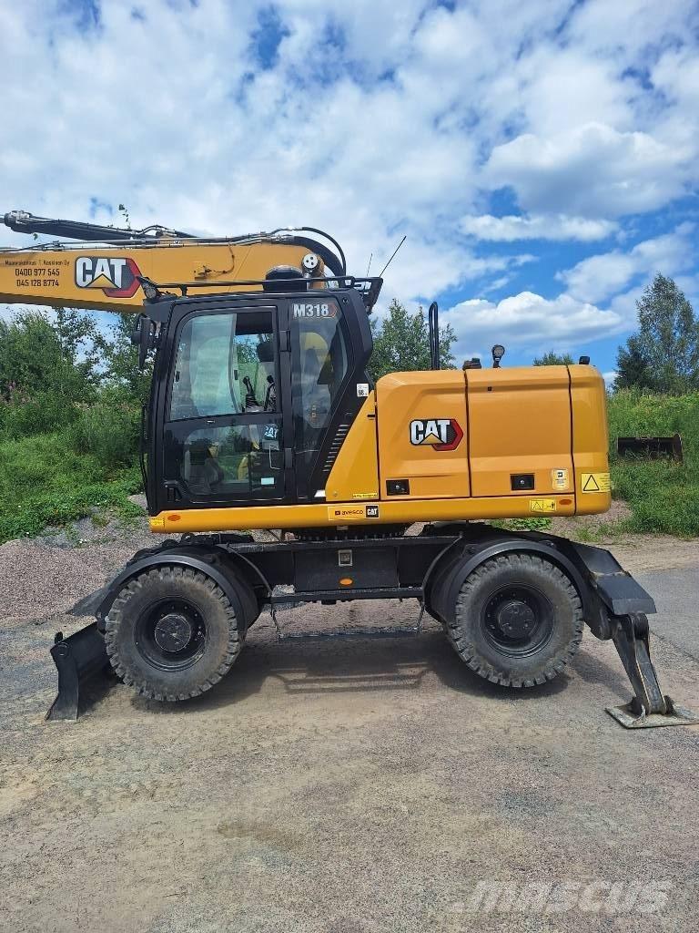 CAT M 318 Колісні екскаватори