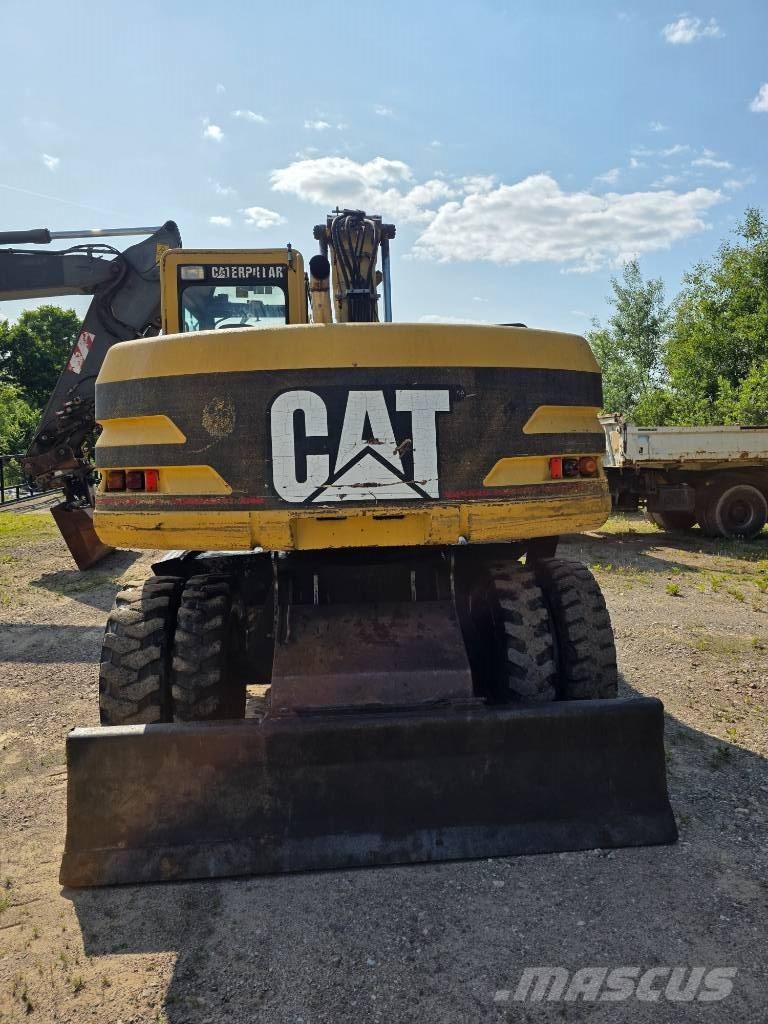 CAT 312 M Колісні екскаватори