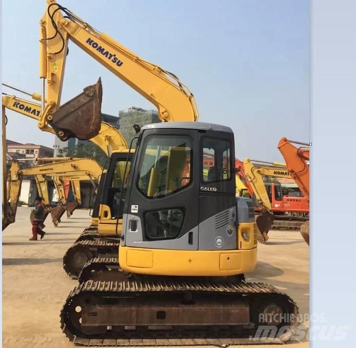 Komatsu pc78us Середні екскаватори 7т. - 12т.