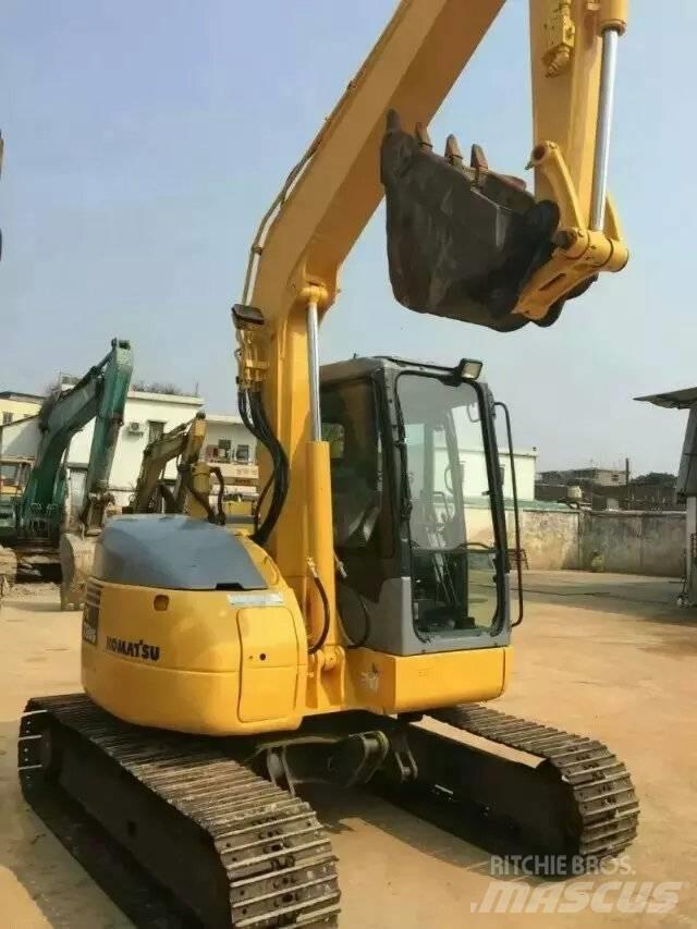 Komatsu pc78us Середні екскаватори 7т. - 12т.