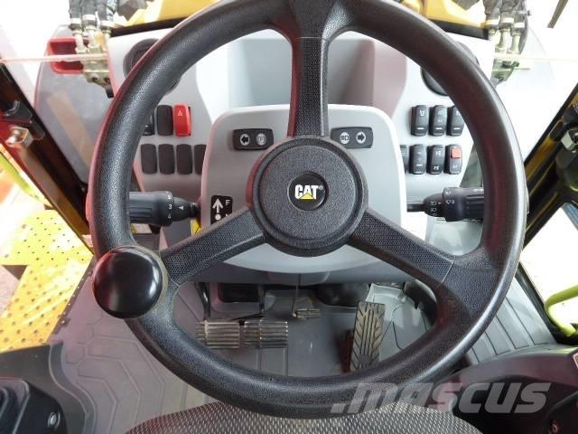 CAT 444 Екскаватори-навантажувачі