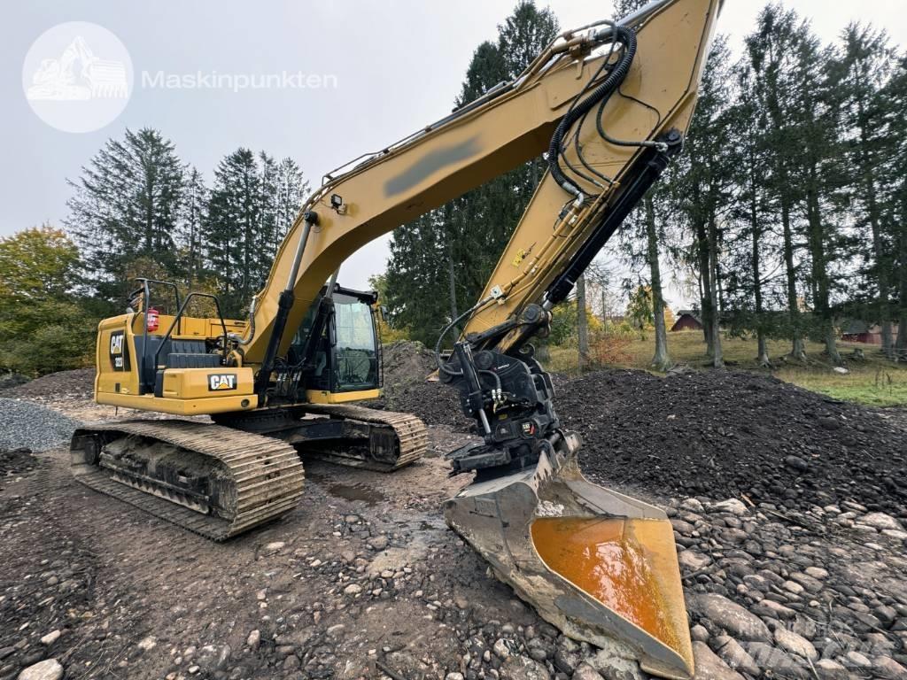 CAT 323 Гусеничні екскаватори