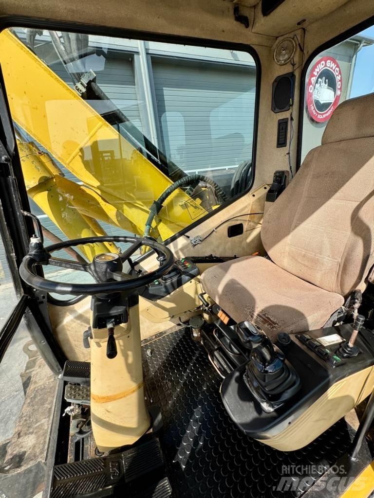 CAT M 312 Колісні екскаватори