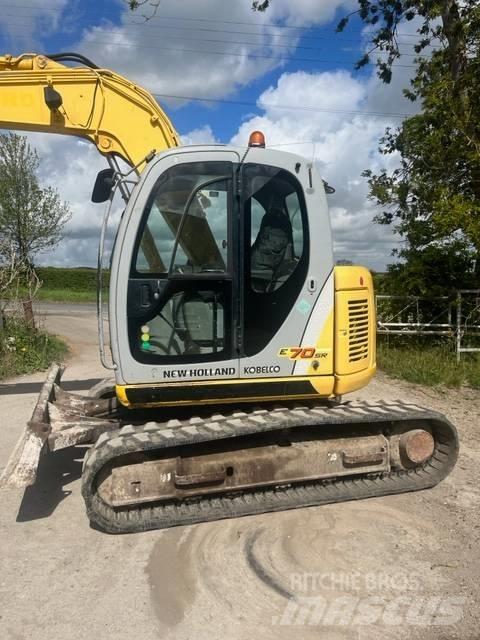 New Holland E 70 SR Середні екскаватори 7т. - 12т.