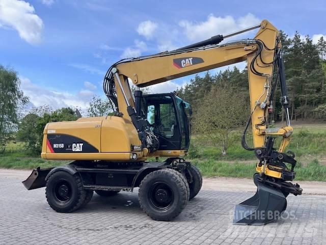 CAT M 315 D Колісні екскаватори