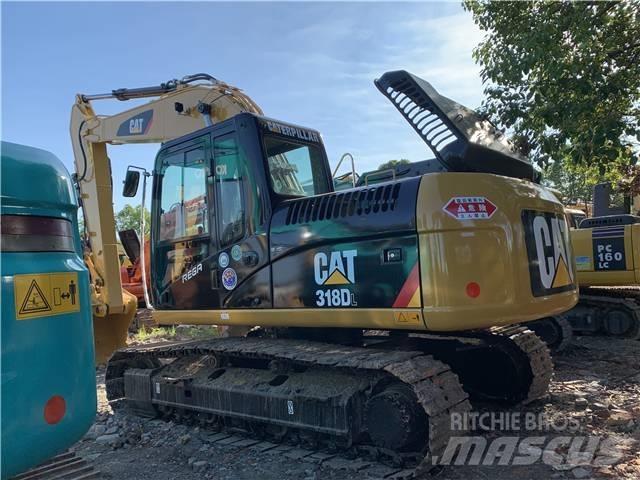 CAT 318DL Гусеничні екскаватори