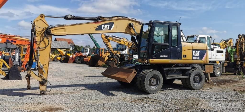 CAT M 315 D Колісні екскаватори