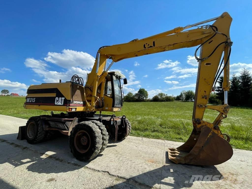 CAT M 315 Колісні екскаватори