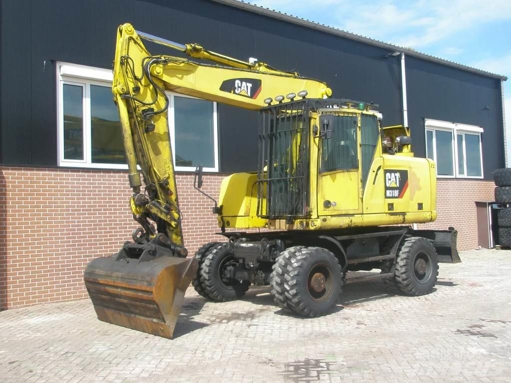 CAT M318F Колісні екскаватори