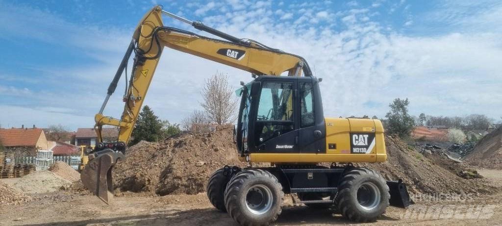 CAT M 313 D Колісні екскаватори