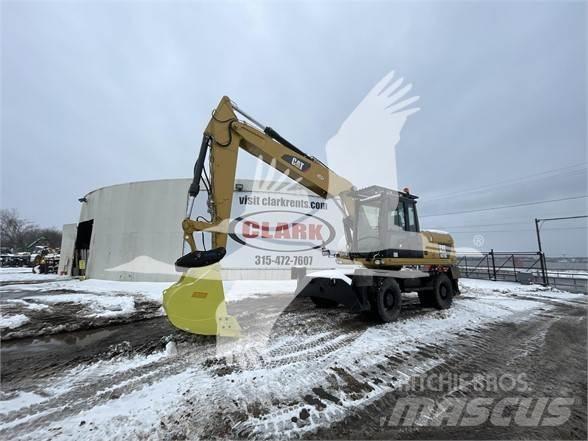 CAT M318D Колісні екскаватори