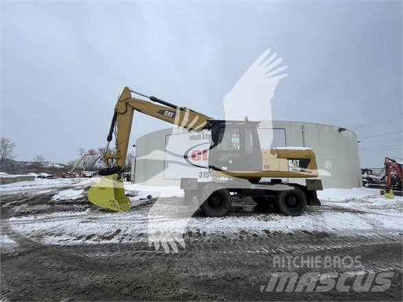 CAT M318D Колісні екскаватори