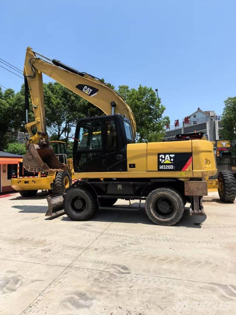 CAT M 320 Колісні екскаватори