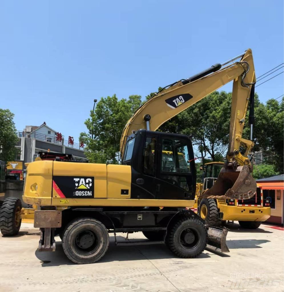 CAT M 320 Колісні екскаватори