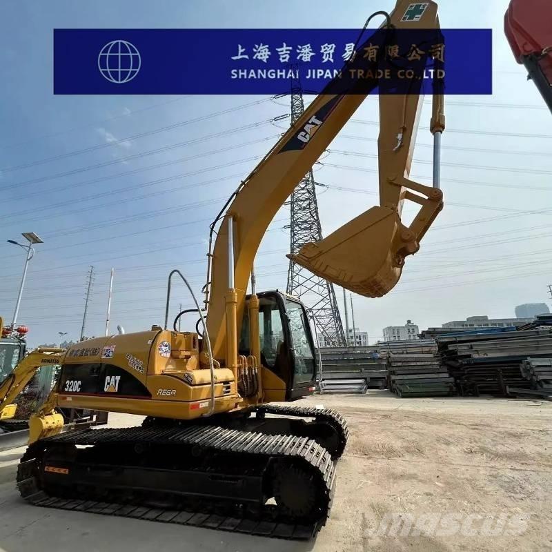 CAT 318 Гусеничні екскаватори